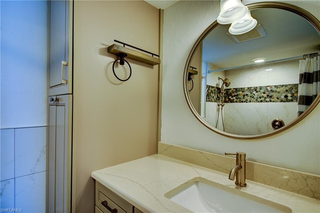 Notice the custom tile inlay in the shower