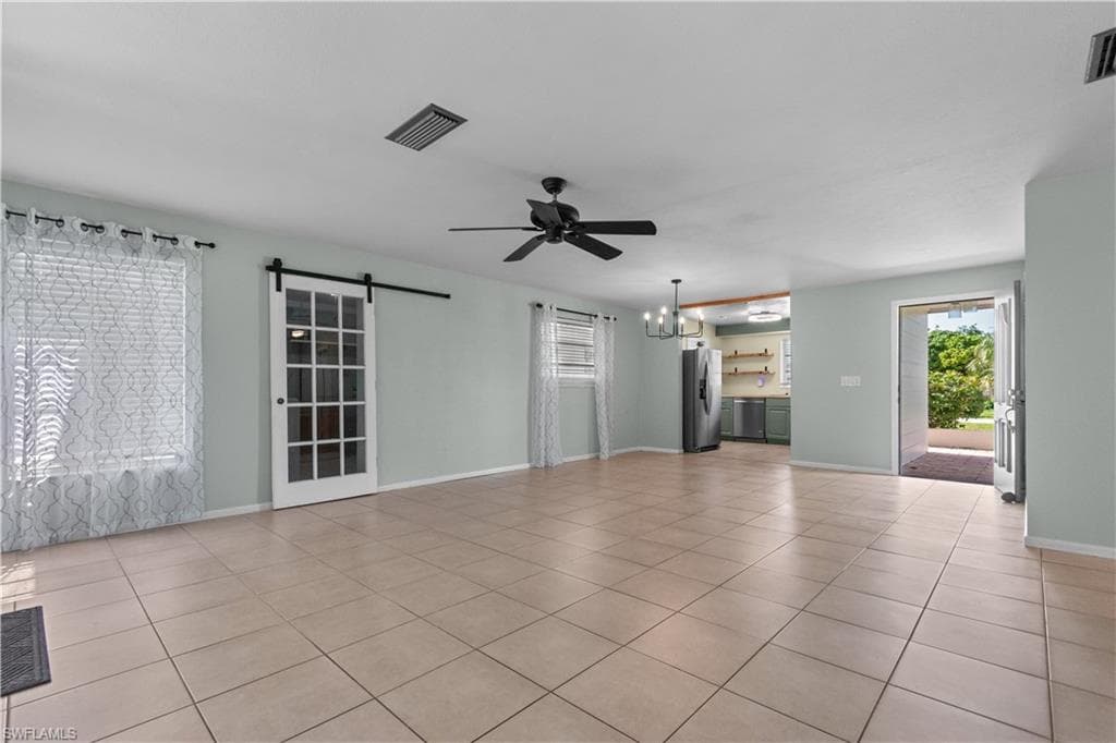 View of the great room, barn doors lead to the laundry room