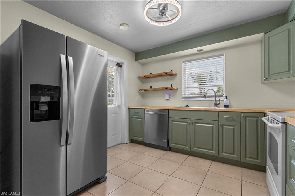 Kitchen with a door to the carport