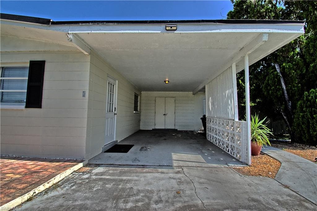 Carport with storage shed
