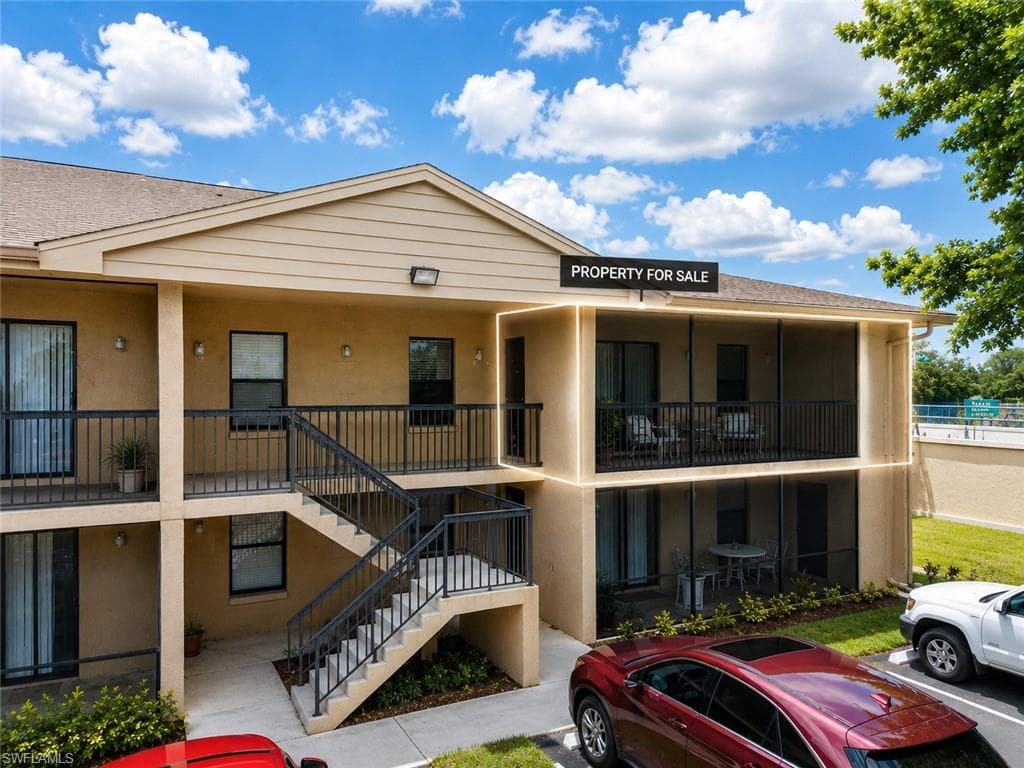 Multi-level stucco exterior with private screened patios and balconies