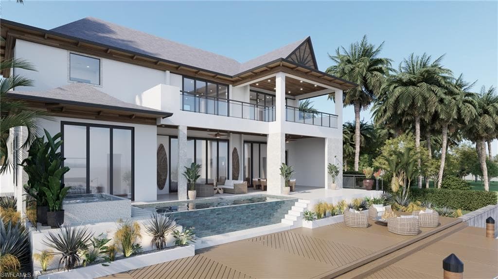 Multi-level outdoor living spaces featuring a pool, integrated spa, and expansive decking