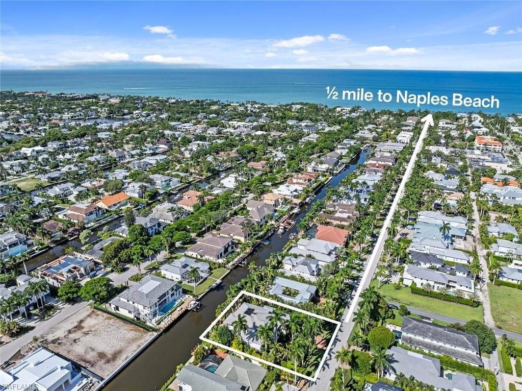 Canal-front property with mature tropical landscaping
