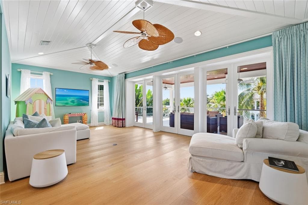 Wood-finish flooring, white paneled ceiling, recessed lighting, and multiple ceiling fans