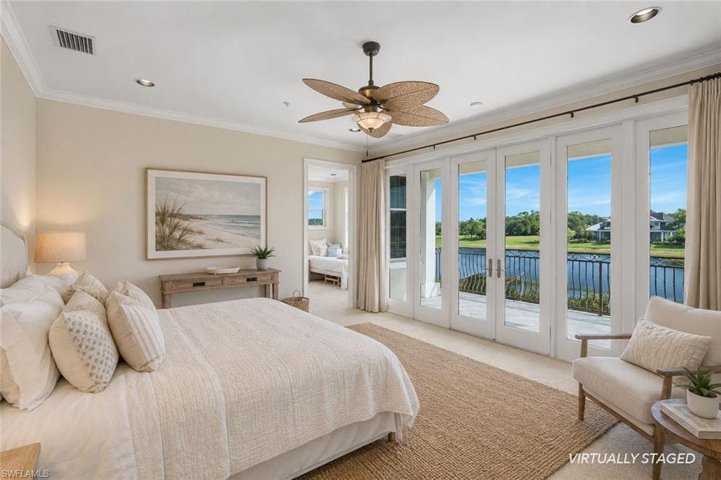 Recessed lighting, crown molding, ceiling fan, expansive glass doors, and a balcony with a metal railing
