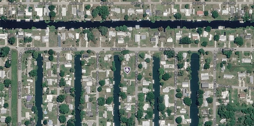 Aerial Survey Map. Orthographic representation of the property and surrounding residential parcels, depicting lot configurations, structures, and vegetation coverage