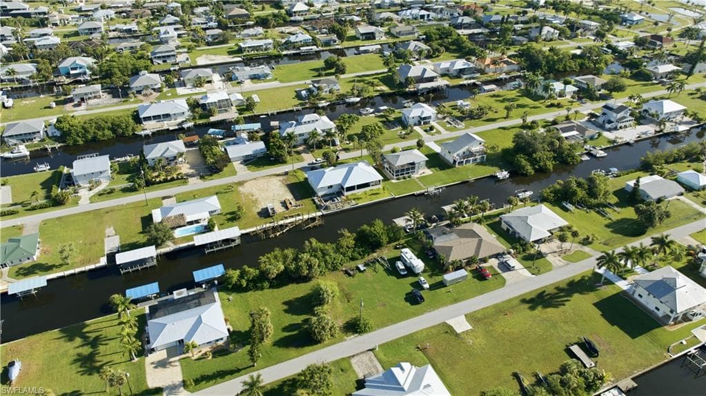 Canal-front homes with private boat docks and surrounding green spaces