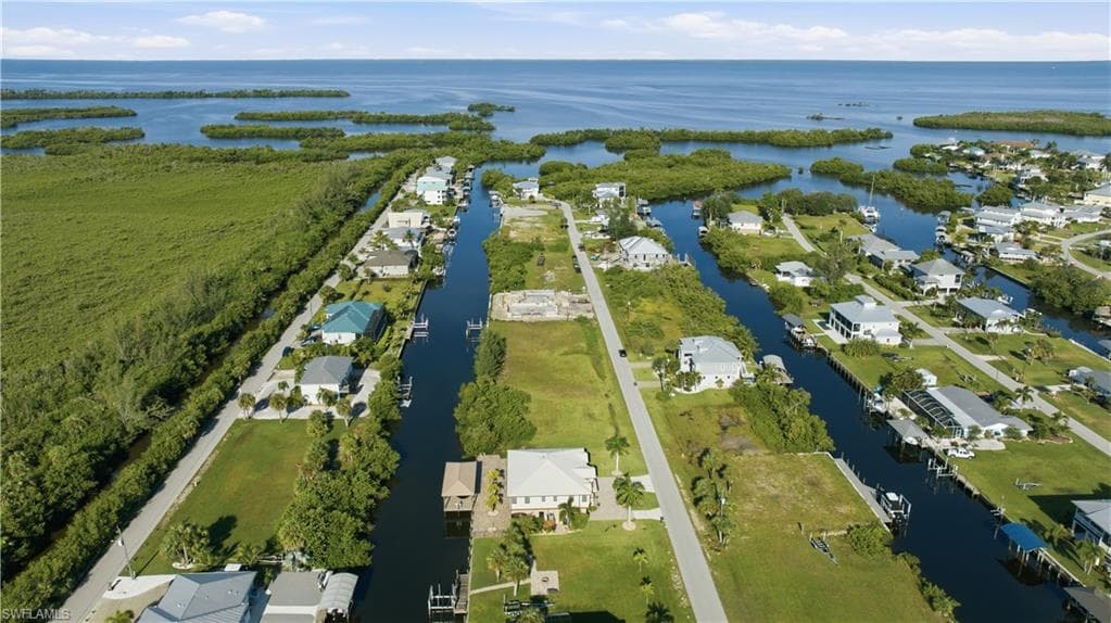 Waterfront community with direct canal access, surrounded by expansive natural landscapes and open water