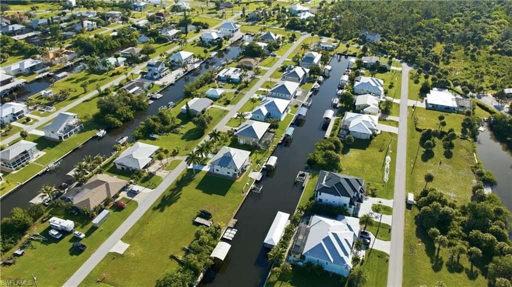 Canal-front properties featuring private docks and mature landscaping