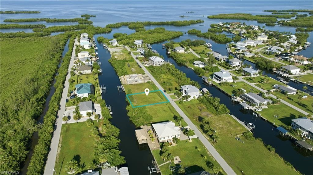 Waterfront lot with canal access and proximity to open water