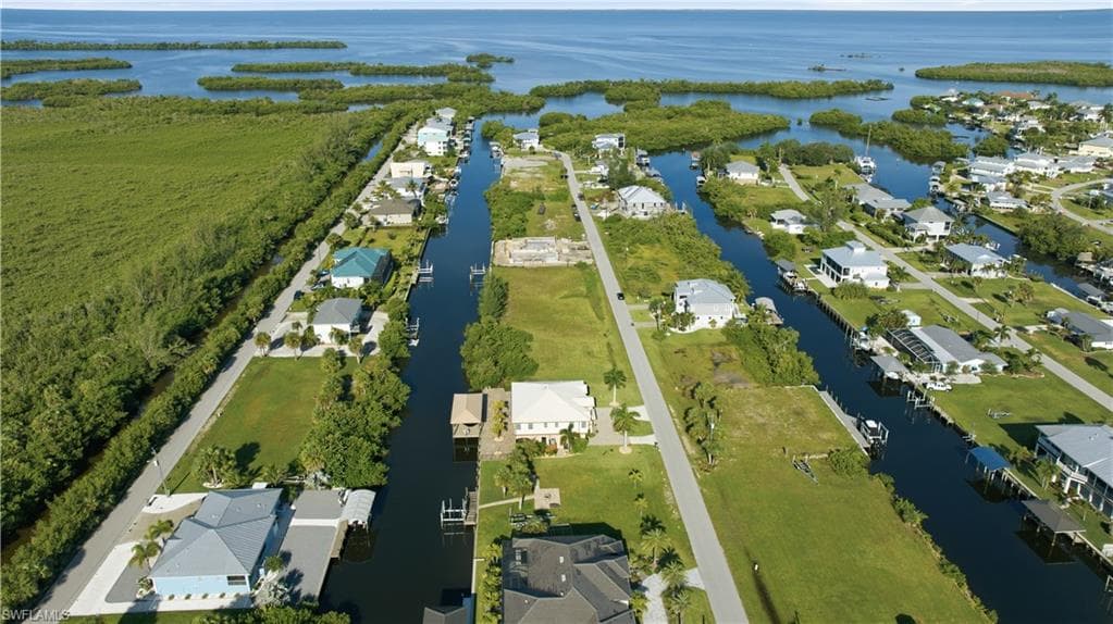 Waterfront community featuring direct canal access, established residences, and undeveloped lots