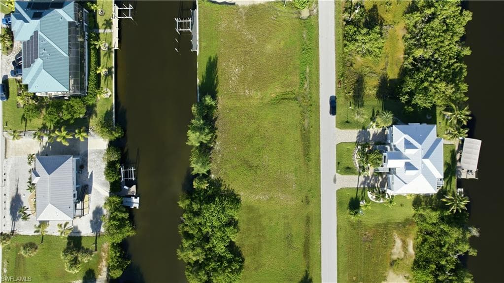 Expansive lot featuring direct canal frontage and street access