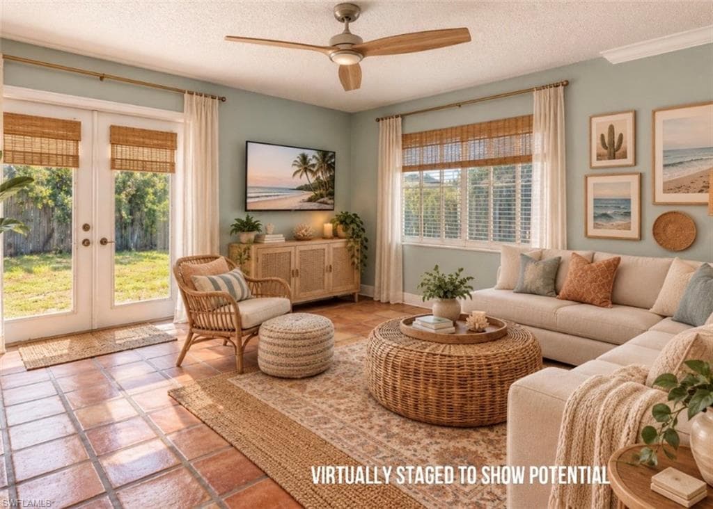 VIRTUALLY STAGED Terracotta tile flooring, a ceiling fan with wood-finish blades, double French doors, and a window with horizontal blinds
