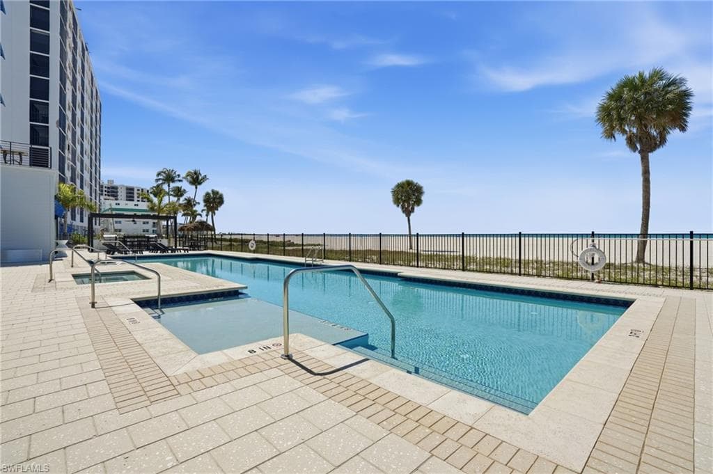 Community pool with a patio area