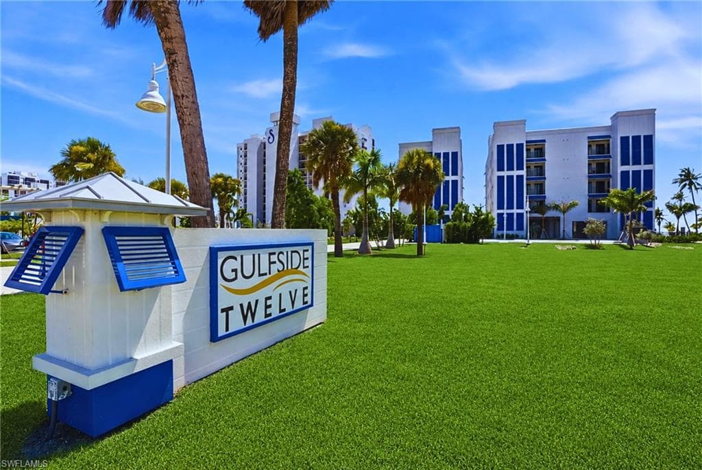 Gulfside Twelve Expansive land parcel with direct beach access, surrounded by established buildings and roadways - Virtually Edited Image