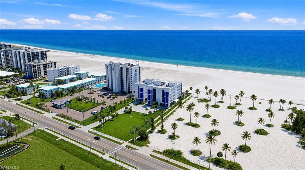 Expansive white sand beach with palm trees and direct access to the ocean - Virtually Edited Image
