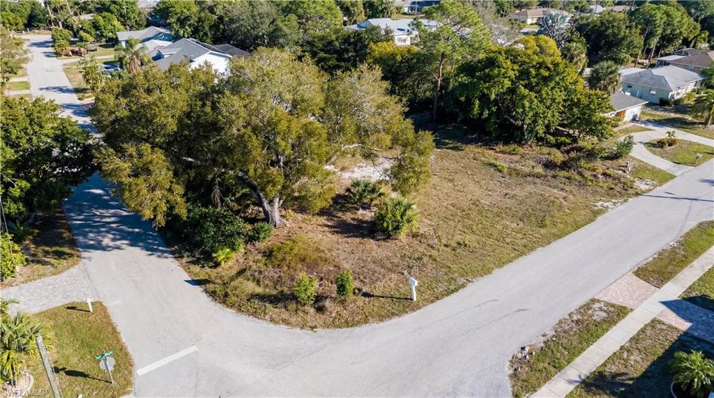 Aerial perspective of suburban area with a tree filled landscape