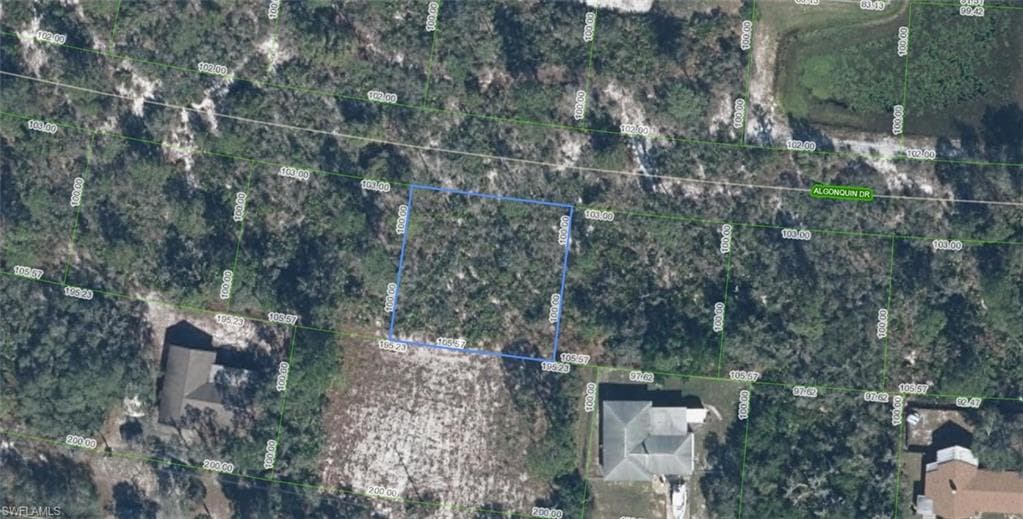 Aerial Survey. Displaying the property's boundaries and surrounding parcels, with an identified street name