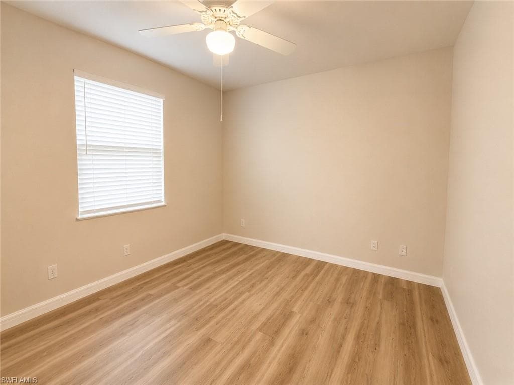 Neutral wall tones with wood-finish flooring