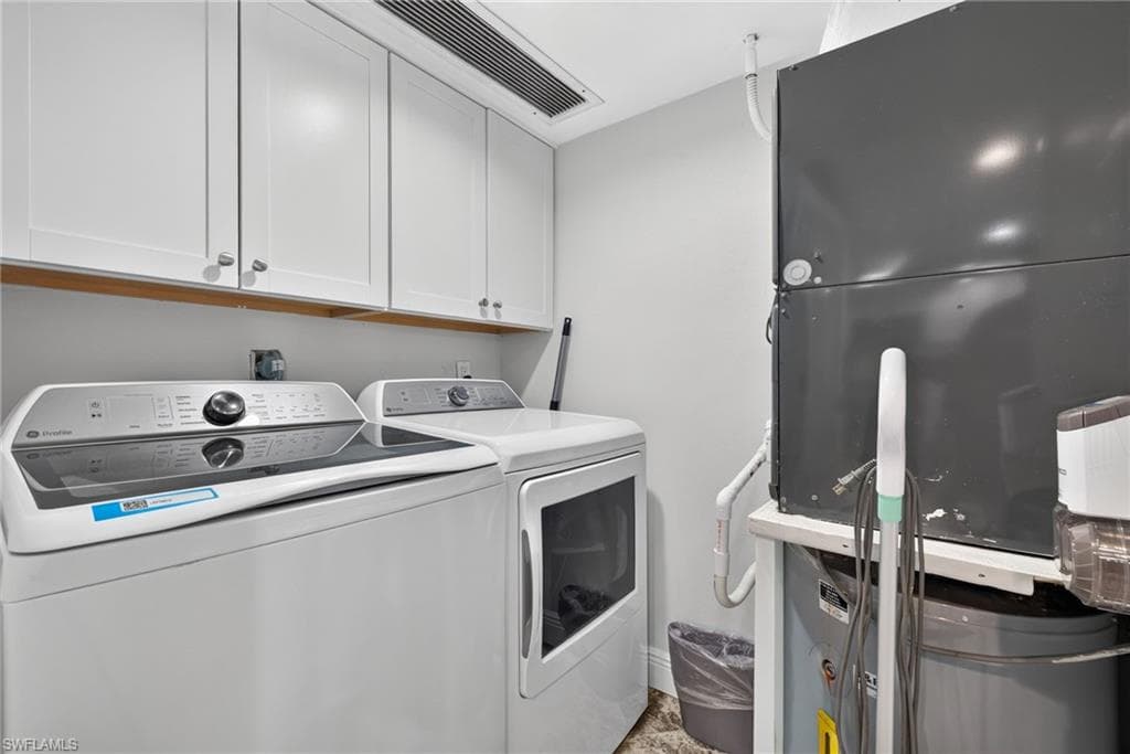 Laundry room with new appliances.
