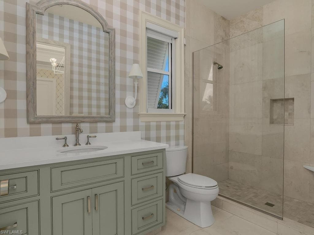 En suite bath for guest bedroom alongside second floor terrace.