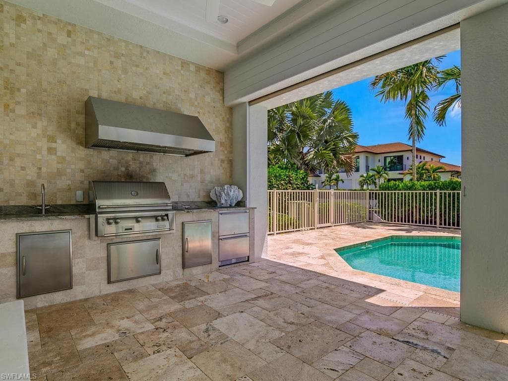 Summer kitchen, poolside and adjacent to dining indoors, too.