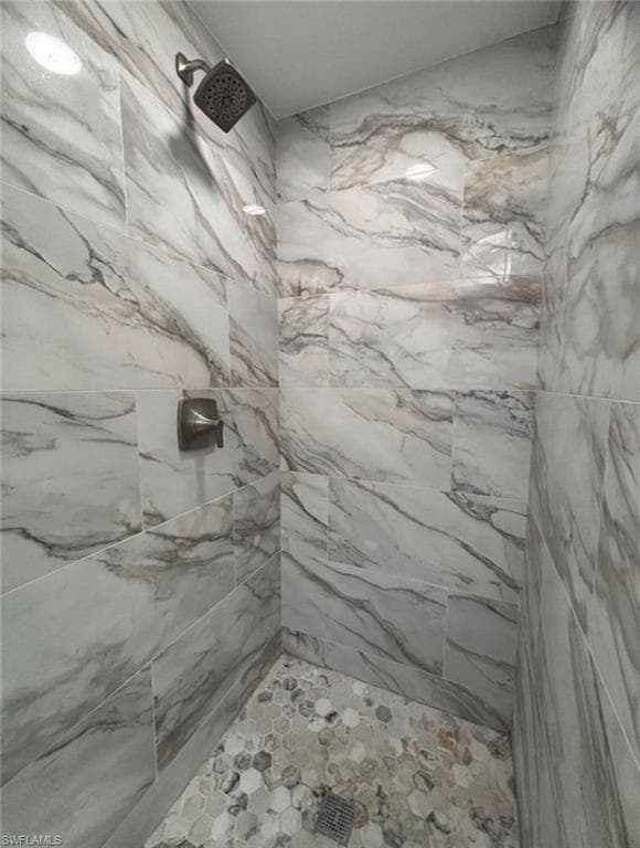 Bathroom with a marble finish shower