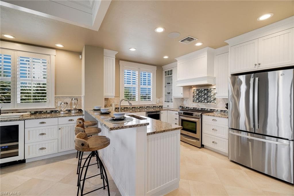 kitchen with stainless stell appliance - Virtually Edited