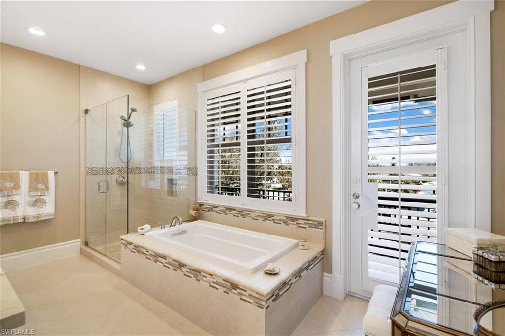 Primary bath with front balcony - Virtually Edited