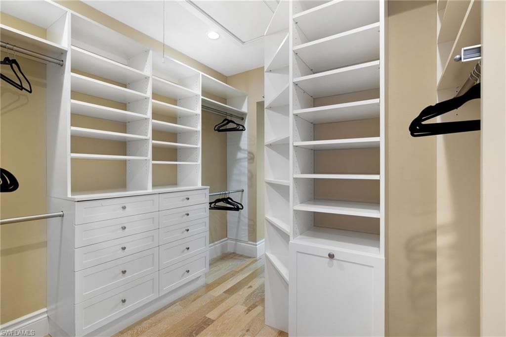 Primary walk-in closet - Virtually Edited
