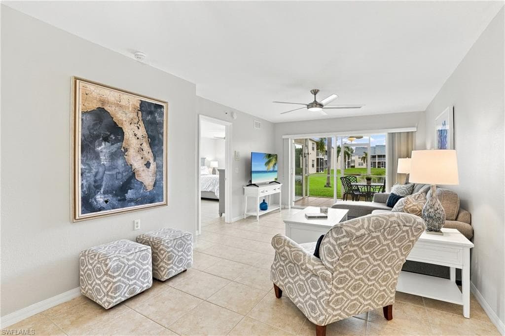 LIVING SPACE WITH SLIDER ENTRY TO REAR SCREENED LANAI...ADDITIONAL OUTDOOR LIVING SPACE OVERLOOKING PEACEFUL POND AND SERENE WATER FEATURE...CUSTOM DESIGNED FURNITURE AND FURNISHINGS!!