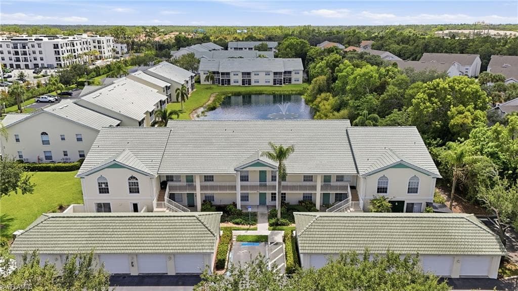 AERIAL VIEW SHOWING FRONT ELEVATION, COURTYARD/TERRACE, AND 1-CAR GARAGE...