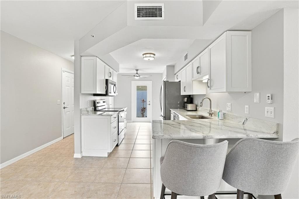 CUSTOM DESIGNED CABINETRY, COUNTERS, AND LIGHTING...