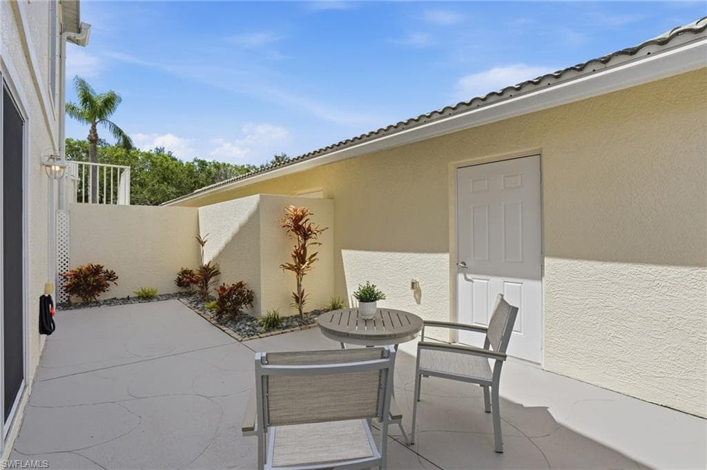 PRIVATE COURTYARD/TERRACE AND ENTRY INTO 1-CAR GARAGE
