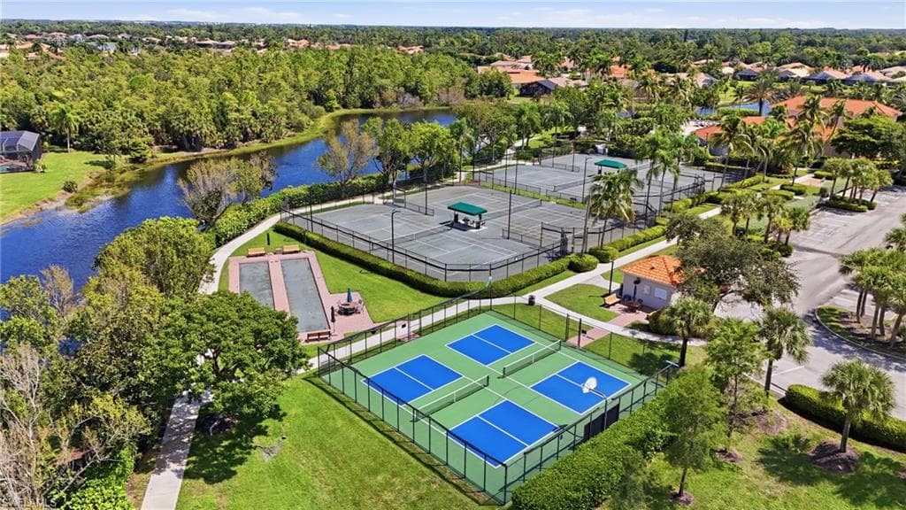 Community amenities featuring multiple tennis courts, pickleball courts, bocce ball courts, and a clubhouse
