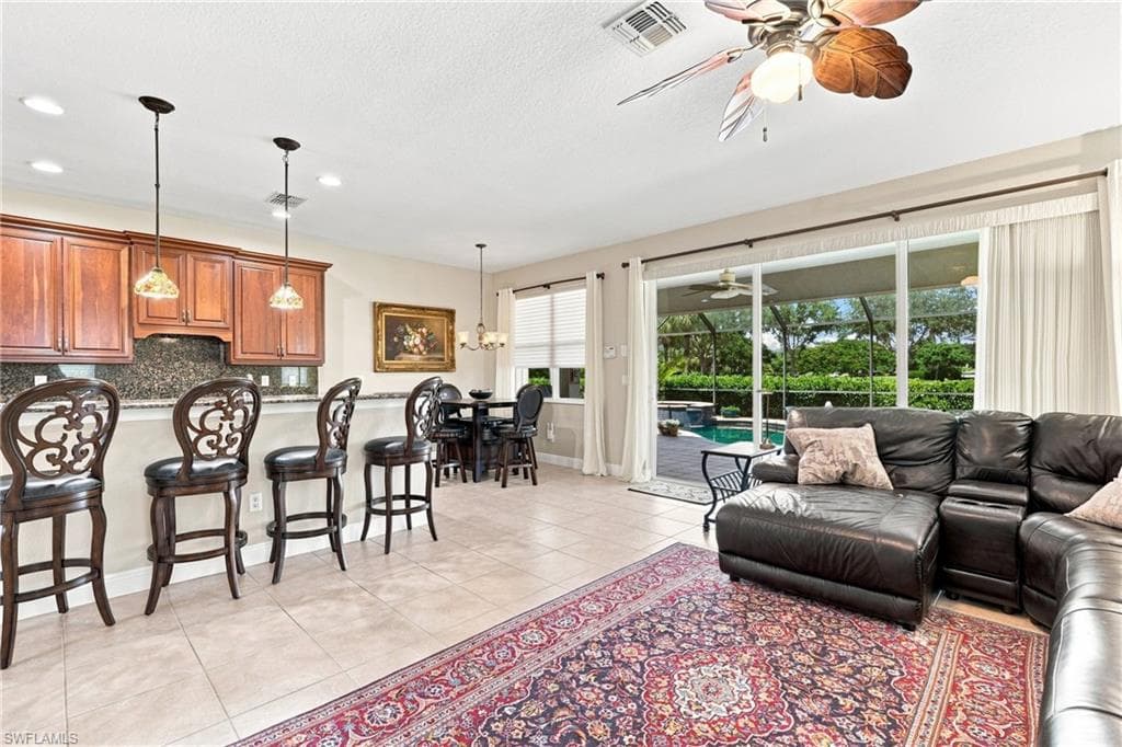 Open-concept living area with tile flooring throughout