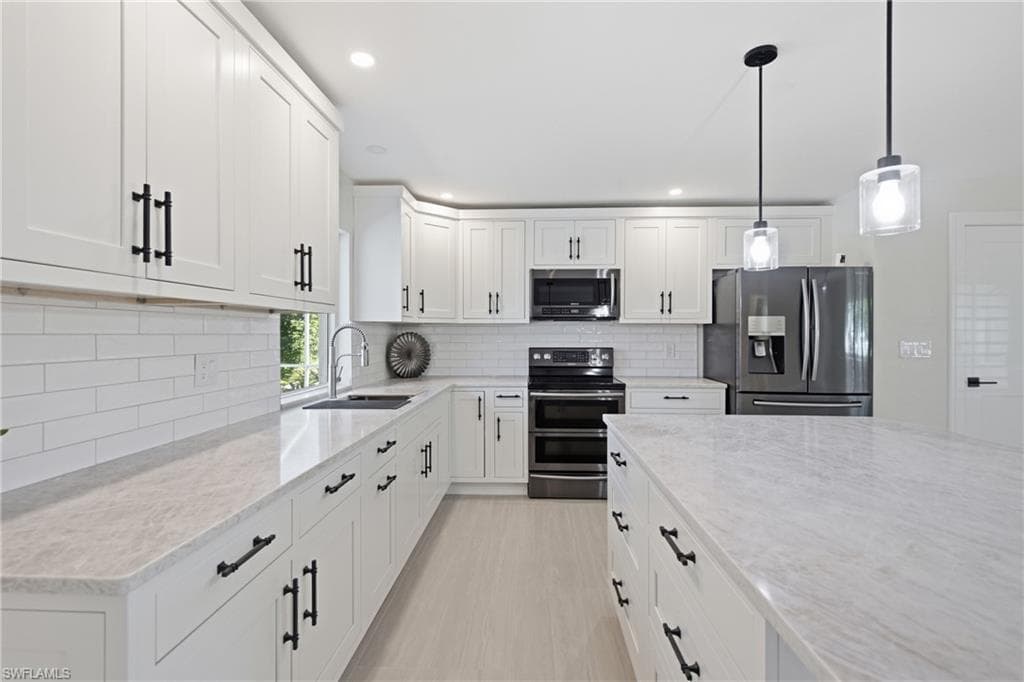 Beautiful Taj Mahal countertops and plenty of cabinet space.
