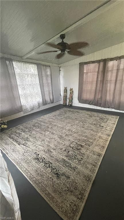 Sunroom featuring ceiling fan