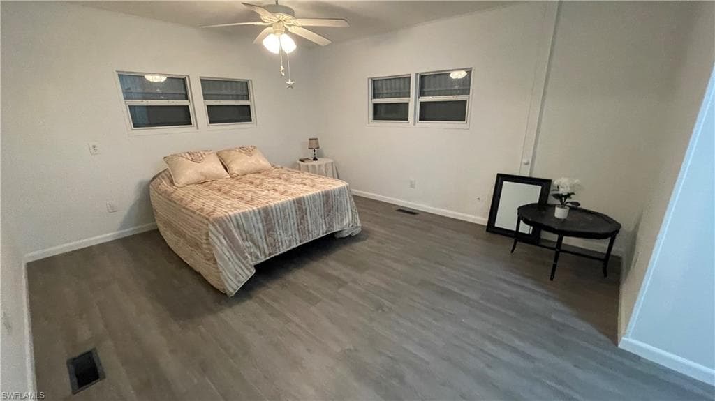 Bedroom featuring ceiling fan and vinyl flooring