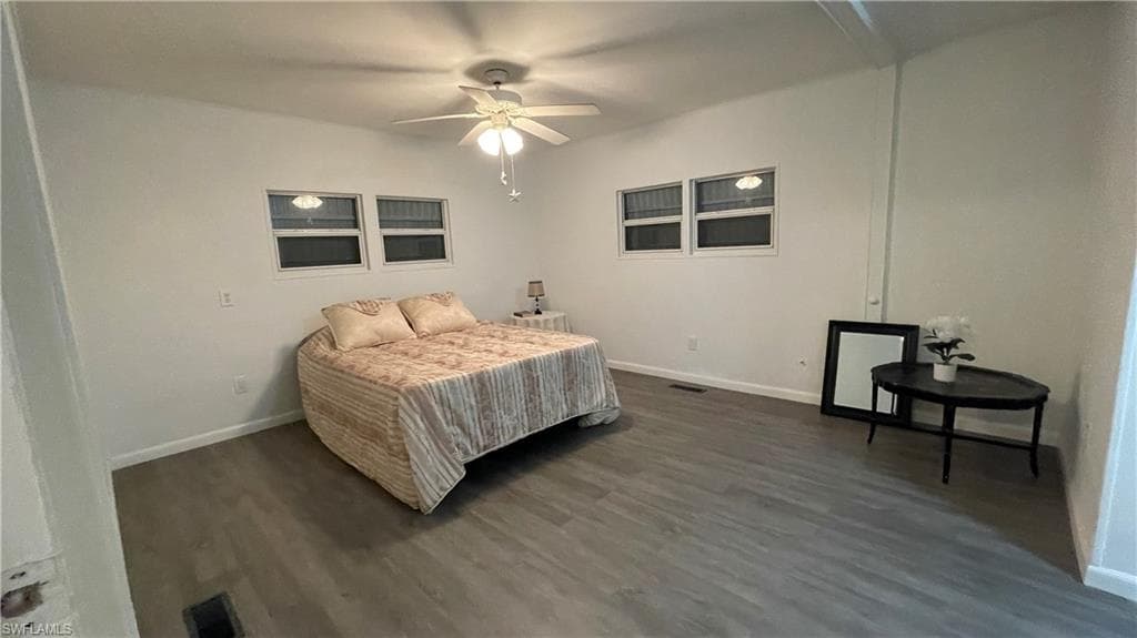 Bedroom featuring ceiling fan and vinyl flooring
