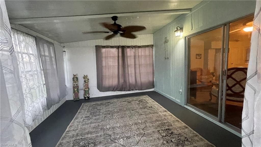Sunroom featuring ceiling fan