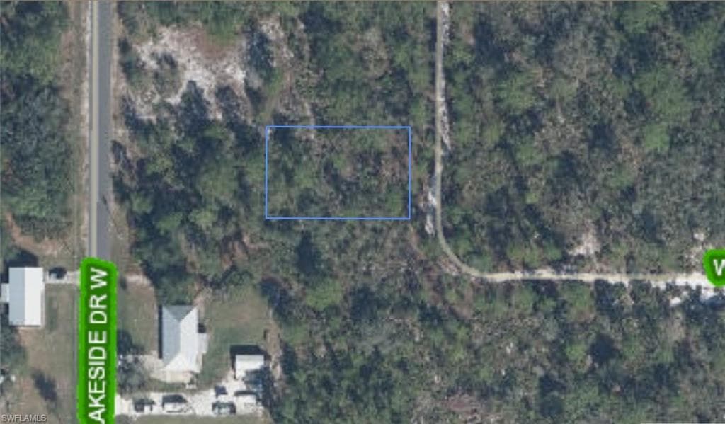 Aerial Map. Displaying the property boundaries outlined in blue, with surrounding roads and existing structures
