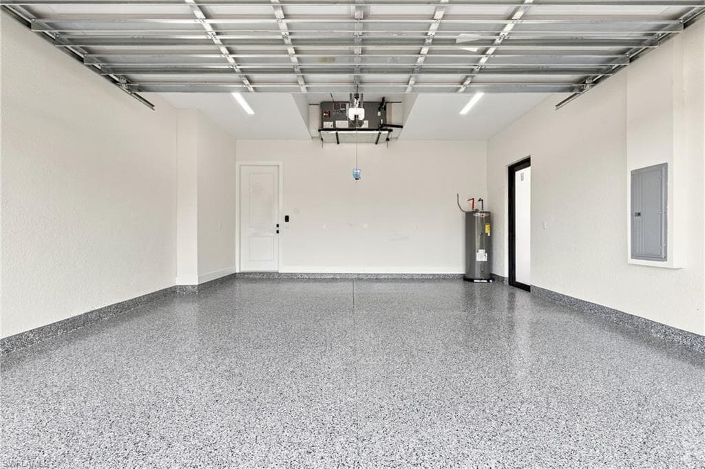 Spacious garage with an epoxy floor finish and white painted walls