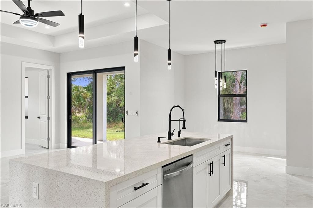 Modern kitchen island with a built-in sink and stainless steel dishwasher