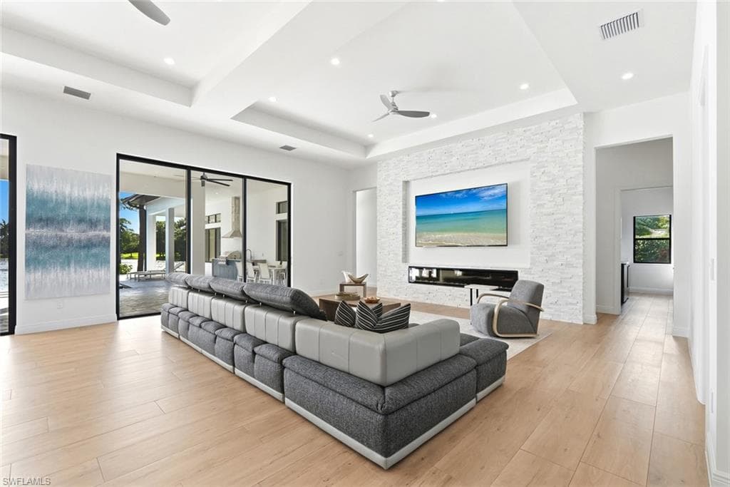 White stone-clad feature wall with built-in fireplace